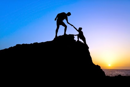 People climbing rock together