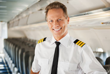 A pilot smiles after seeking Addiction Treatment for Airline Pilots