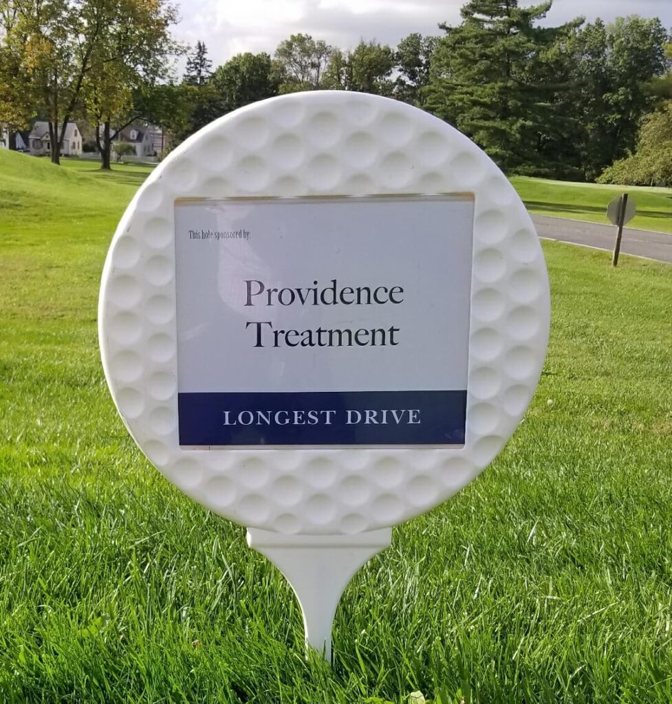 A sign at a golf charity event sponsored by Providence Treatment