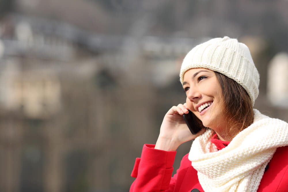 a woman smiles as she practices saying no this holiday season