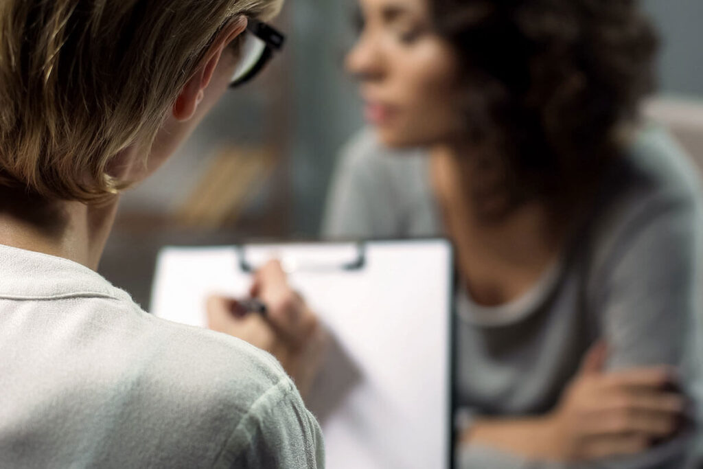 a counselor explains what is psychotherapy to a client