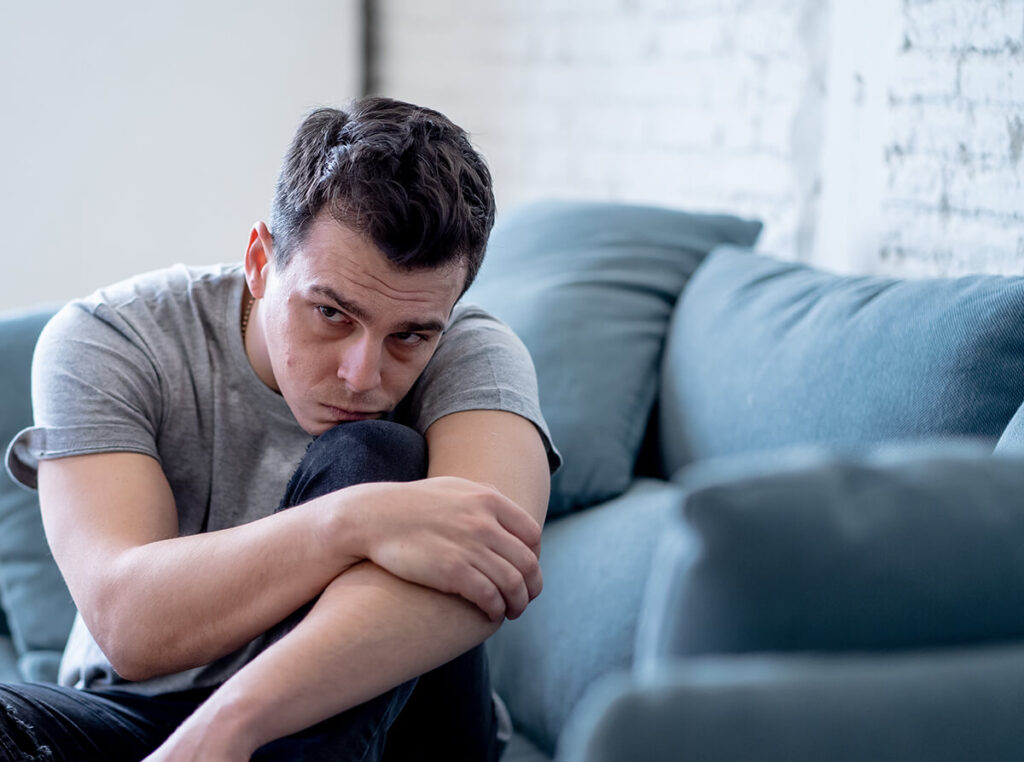 Man going through marijuana withdrawal symptoms