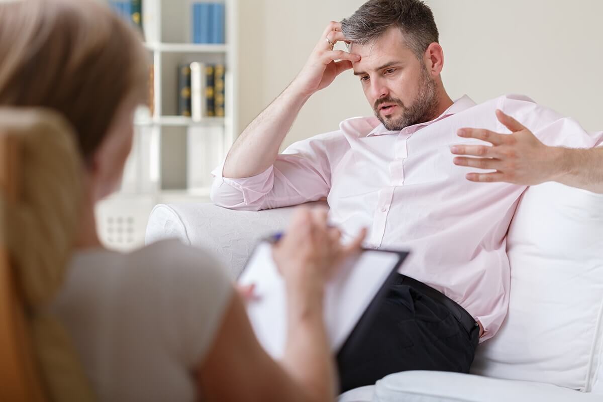 Man speaks during an intensive outpatient program for mental health