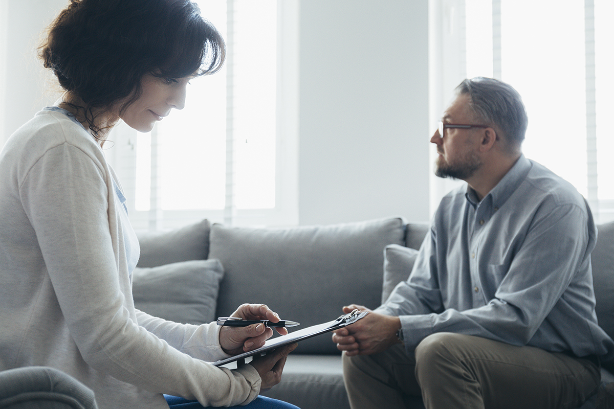 Man benefitting from cognitive behavioral therapy techniques